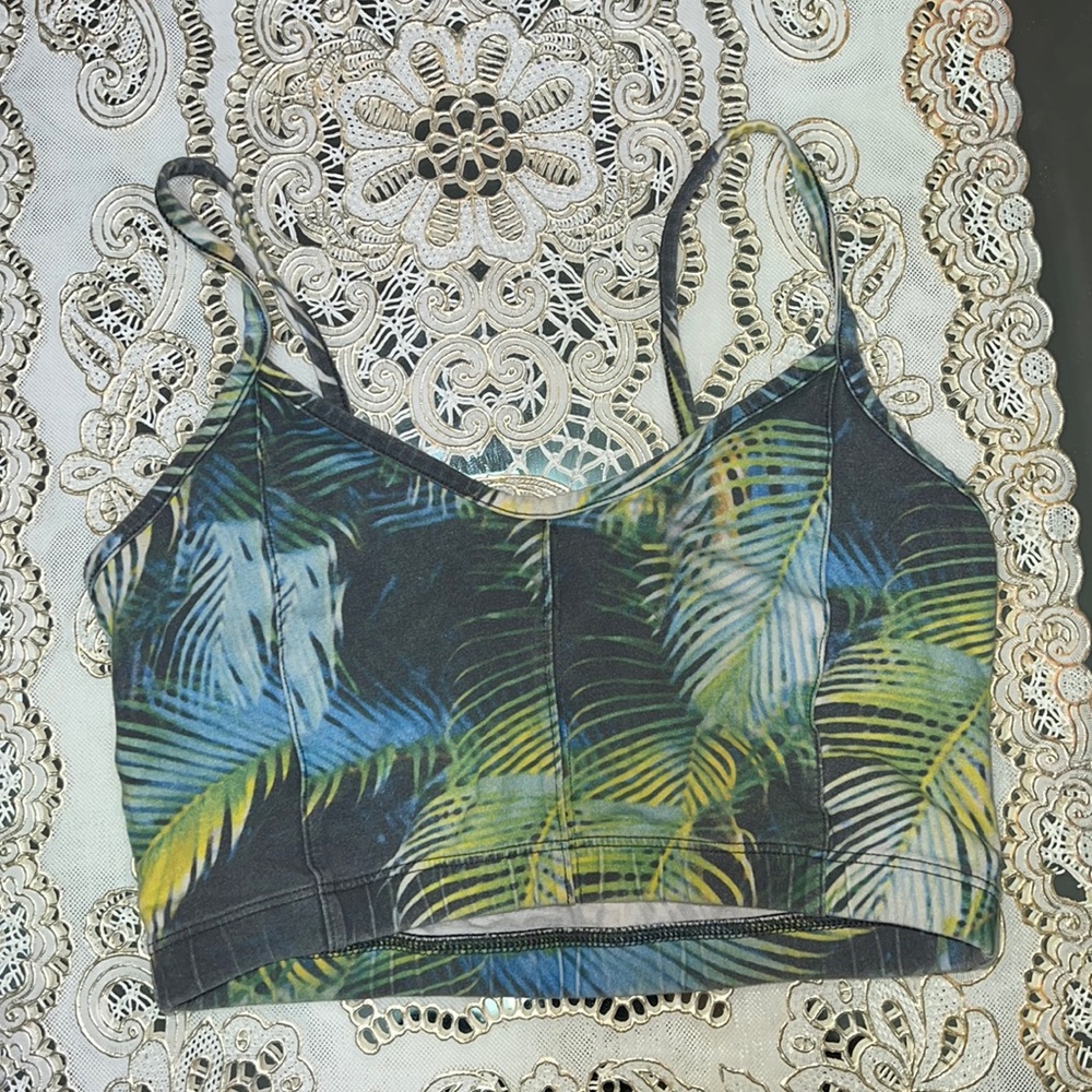 Aritzia TNA grey sports bra with green and blue tropical leaf print